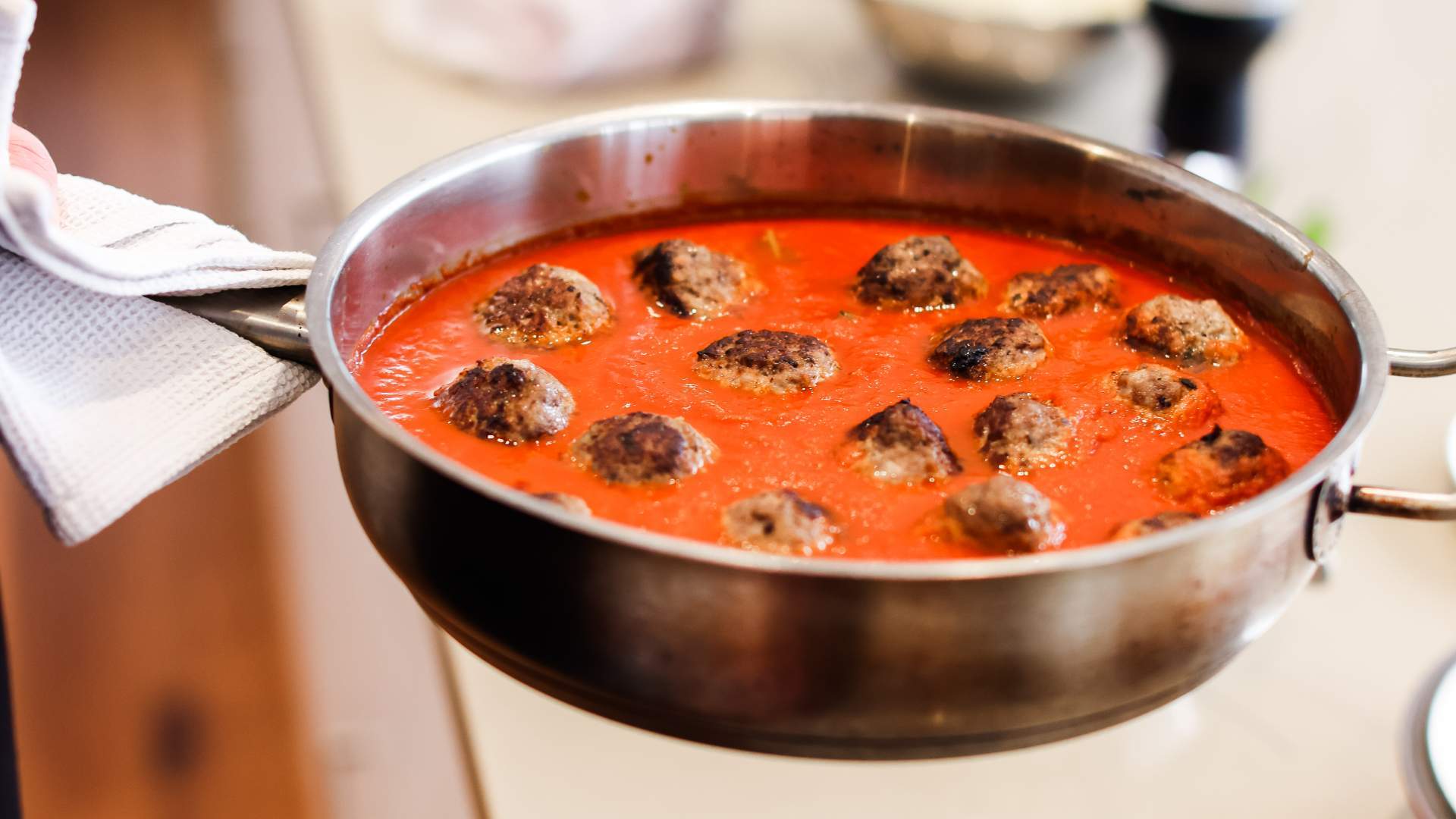 Meatballs simmering in tomato sauce